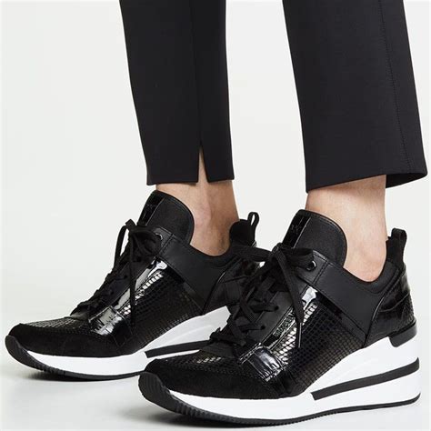 michael kors tennis shoes black and white|Michael Kors white designer sneakers.